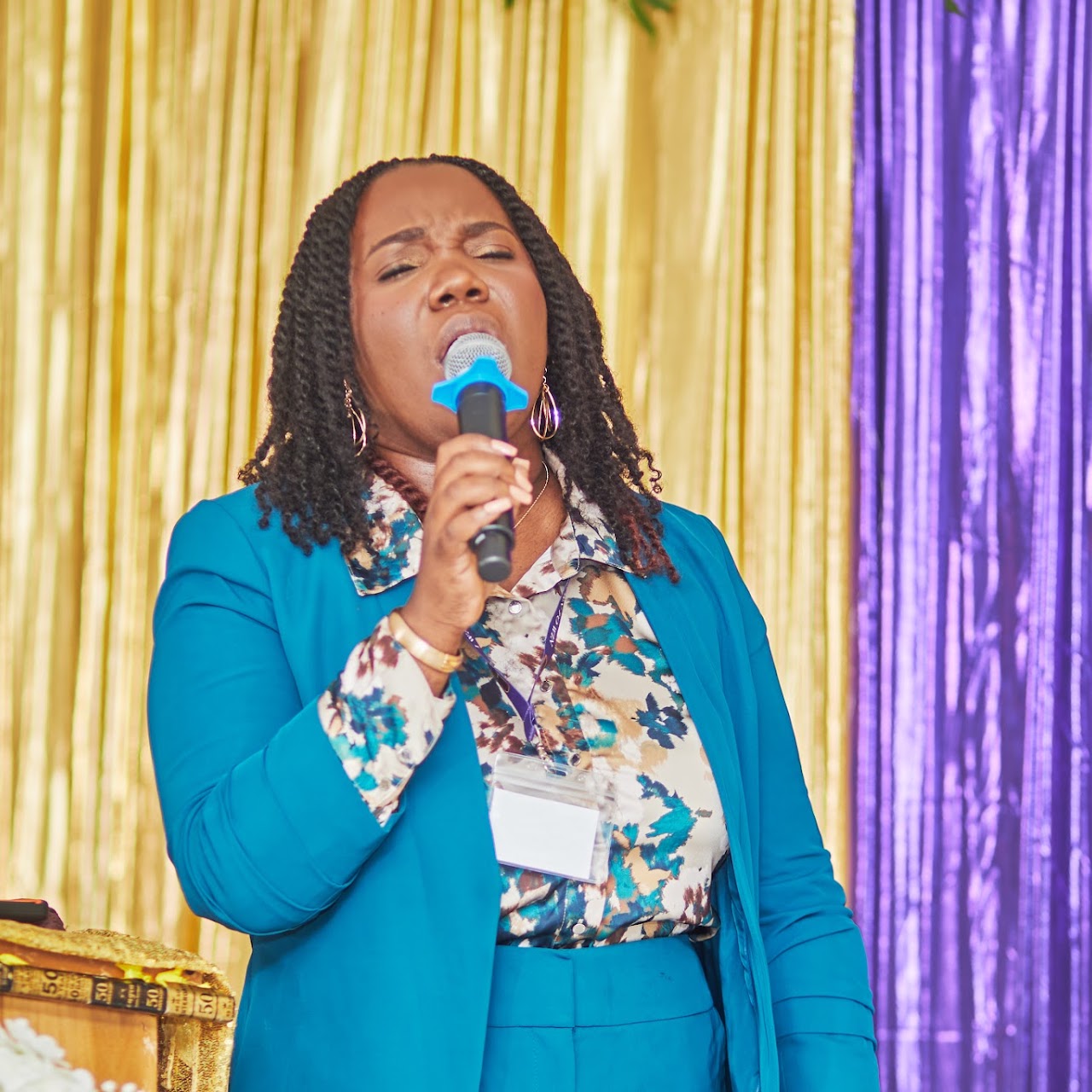 A speaker ministering at a W.I.N. conference